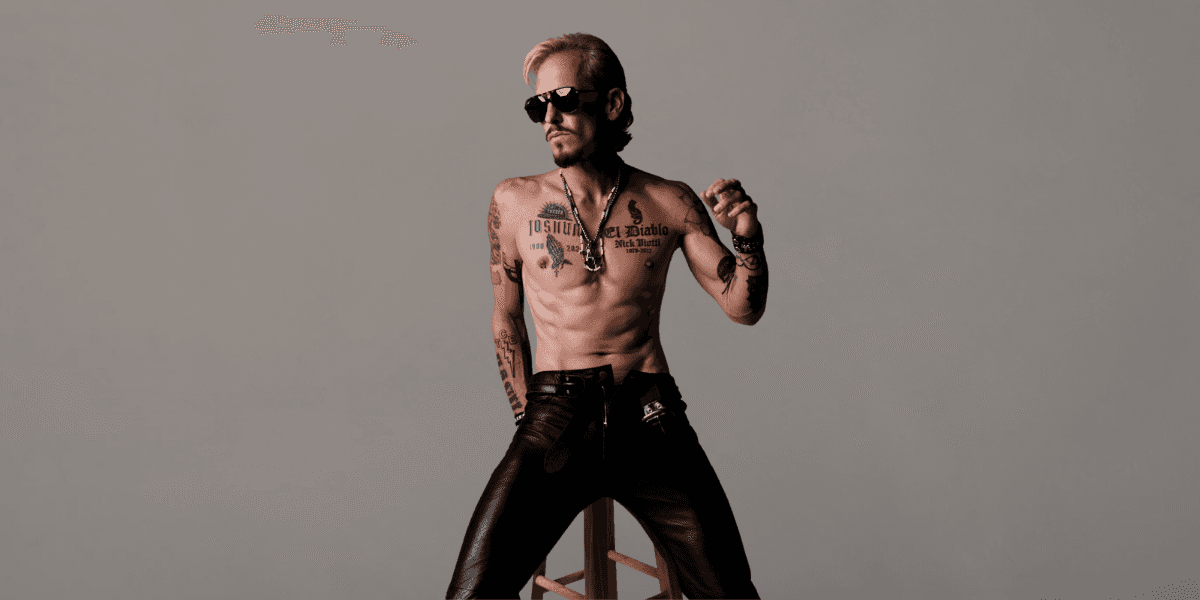 C.J. Shaman striking a powerful pose, embodying his raw, rebellious rock persona.