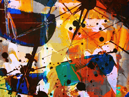 Abstract colorful artwork with vibrant brushstrokes and splatters creating dynamic shapes.