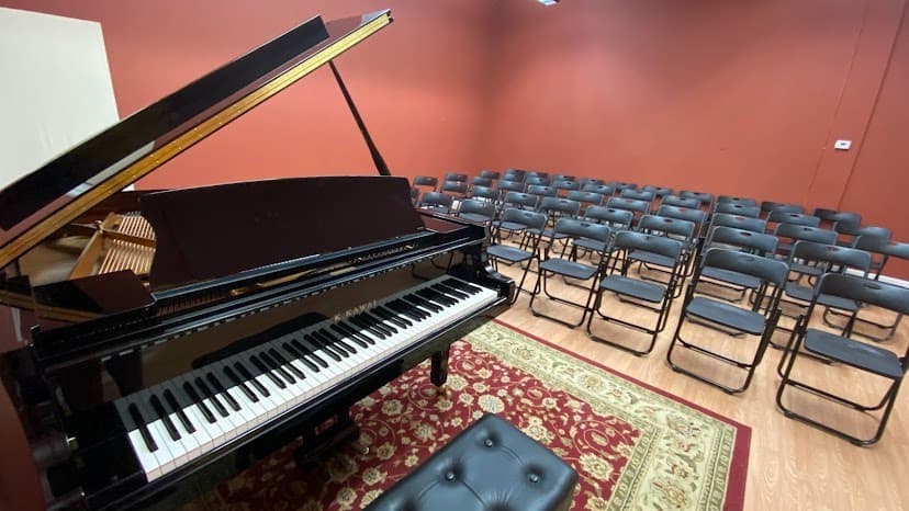 Showroom at Worldwide Piano featuring a selection of new and pre-owned instruments, emphasizing personalized service and quality craftsmanship.